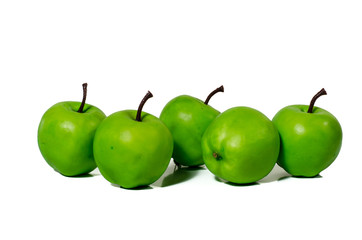 Artificial green apple on white background, clipping part closeup