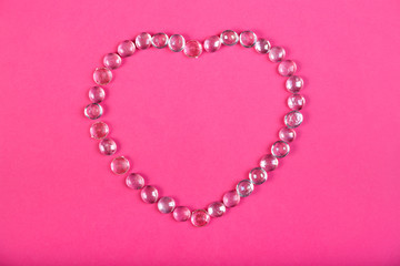 Beaded heart on a pink background horizontal