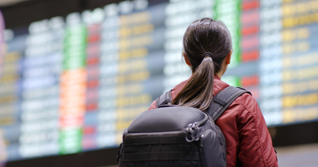 Woman backpacker go travel at the airport