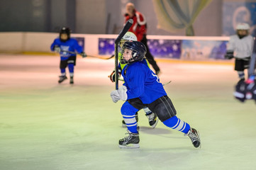 Fototapeta na wymiar Sport for Kids. Young ice hockey players