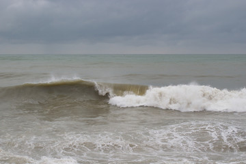Waves on the sea near the pier overcast