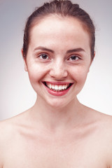 Portrait of happy smiling woman with freckles