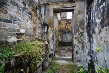 Fototapeta na wymiar Ruined door in abandoned house