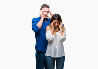 Young couple in love over isolated background with hand on head for pain in head because stress. Suffering migraine.