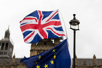 Fototapeta na wymiar European Union and British Union Jack flag flying together. A symbol of the Brexit EU referendum