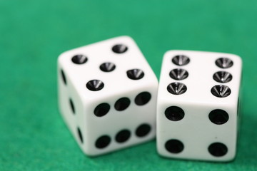 Dices on green background.