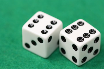 Dices on green background.
