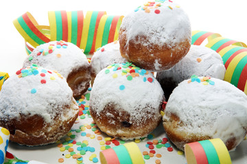 German donuts with jam and icing sugar. Carnival powdered sugar raised donuts
