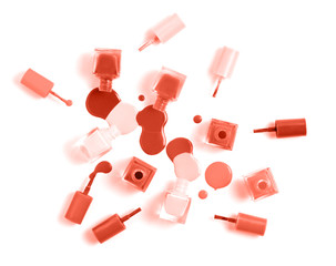 Creative Living Coral colored flat lay of fashion bright nail polishes on a living coral background. Minimal style. Color of the year 2019 concept. blogger concept. 16-1546