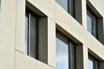 Abstract fragment of modern architecture, walls made of glass and concrete.