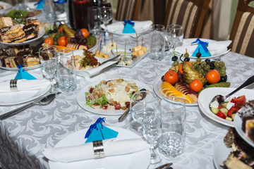 Served wedding table with snacks for different flavors