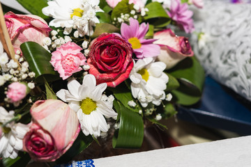 wedding decorations of flowers, baskets, cake for brides