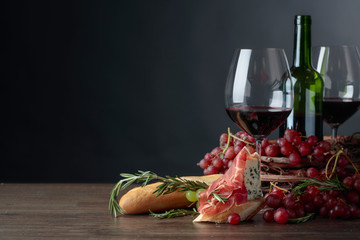  Delicious snack and glasses of red wine.