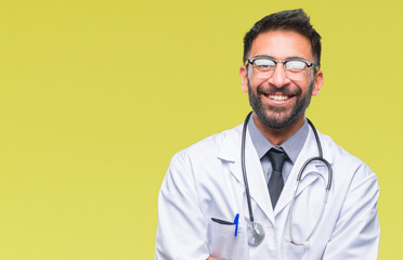 Adult hispanic doctor man over isolated background happy face smiling with crossed arms looking at the camera. Positive person.