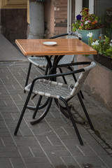 Table with chairs near the street café.