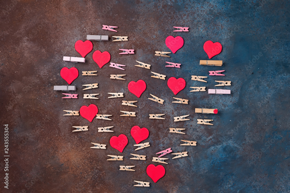 Canvas Prints red hearts and clothespins made heart isolated on stone background - Valentine's day concept