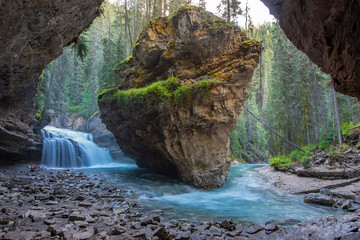 Johnston Canyon cave in Spring season with waterfalls, Johnston Canyon Trail, Alberta, Canada