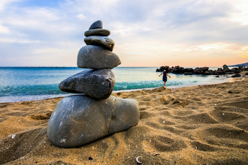 Stone cairn at the beach, concept of balance