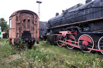 Plakat An old and historic steam locomotive and wagon