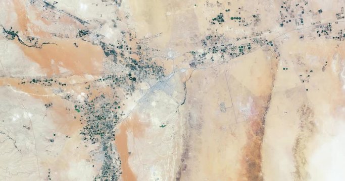 Hurtling toward earth, out of control, over desert terrain in Saudi Arabia. Vibration and camera shake. Elements of this image furnished by NASA