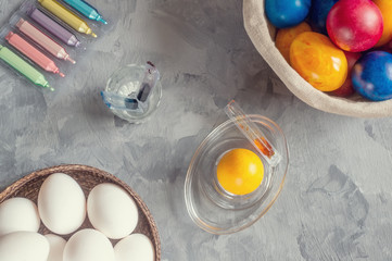 Chicken white eggs are ready for painting with colorful paints for Easter. Close-up.