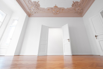 open  door in empty room of old apartment after refurbishment