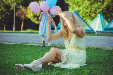 Beauty woman with naughty child. Beautiful happy young woman having fun from disobedience. child...