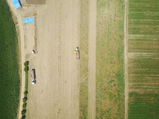 aerial shots of harvesting of a field
