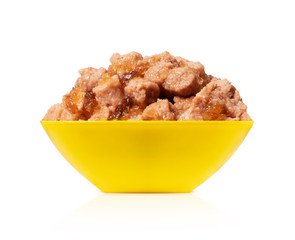 Wet food for dogs and cats in a bowl close up, isolated on white background