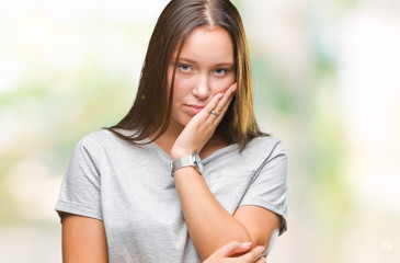 Young caucasian beautiful woman over isolated background thinking looking tired and bored with...