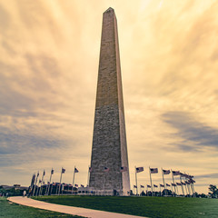 Fototapeta premium Washington monument with flags and split tone processing