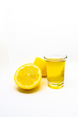 A Mexican tequila shot with lemon on a white isolated background