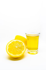 A Mexican tequila shot with lemon on a white isolated background