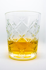 A beautiful glass of Irish wiskey an alcoholic beverage isolated on a white background