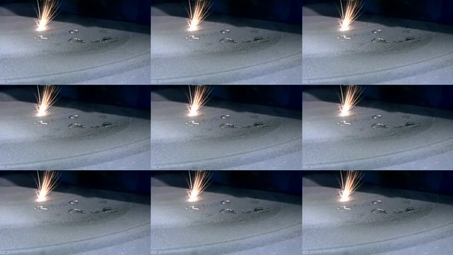 3D printer printing metal. Laser sintering machine for metal. Metal is sintered undr action of laser into desired shape in working chamber. Abstract animation wall. Multicam split screen group montage