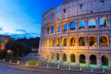 The Colosseum illuminated at dawn in Rome, Italy