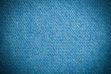 Fototapeta na wymiar blue knitting wool texture with vignette background. fabric cloth
