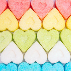 Colorful valentine hearts candy on white background.  Sweets hearts. Valentine’s day symbol. Festive treat. Valentine day background.