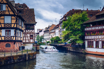 Fototapeta na wymiar Beautiful view of the historic town of Strasbourg, colorful houses on idyllic river. Strasbourg, France