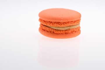 orange  macarons on white