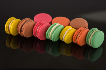 colorful macarons on black 