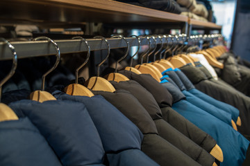 Fototapeta premium Fashionable clothes in a boutique store in Venice. Colorful fashionable clothes. 