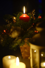 a few candles and pine decoration