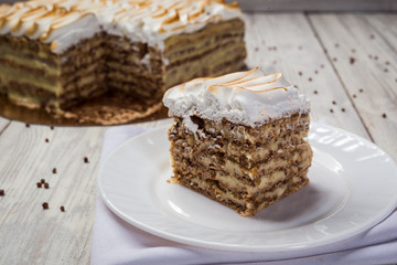 shortbread cake with cream with condensed milk, chocolate and nuts