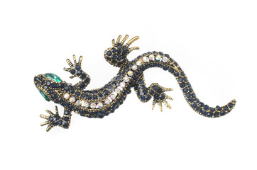 gold brooch lizard with gems isolated on white