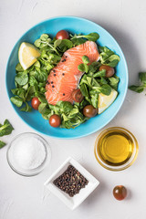 Salmon salad and ingredients bowls