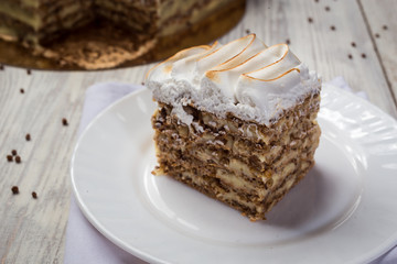 shortbread cake with cream with condensed milk, chocolate and nuts