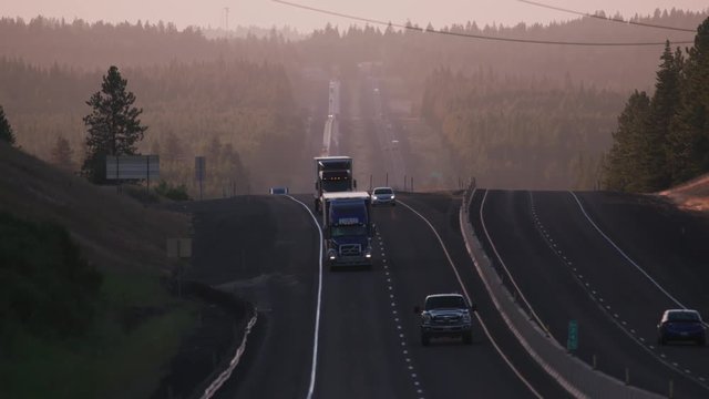Oregon circa-2018.  Trucks and cars driving down freeway