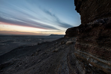Desert mountain landscape with amazing sky after sunset at Jebel Dist