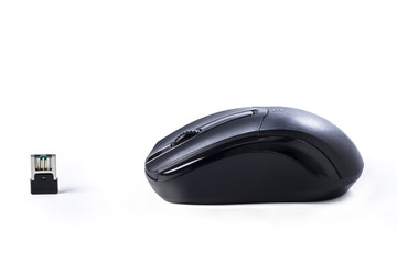 A black wireless mouse on white. Side view